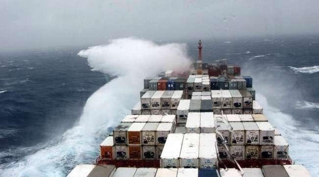 shipping containers on ship in high storm waters
