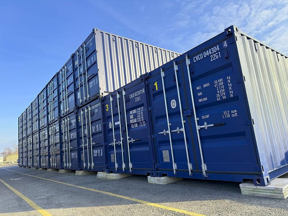 Metal shipping containers stacked at a busy international port